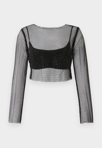 Svart mesh crop top med lange ermer, som har et fiske-nett design og et solid svart underlag. Kantene er rå og litt frynset.