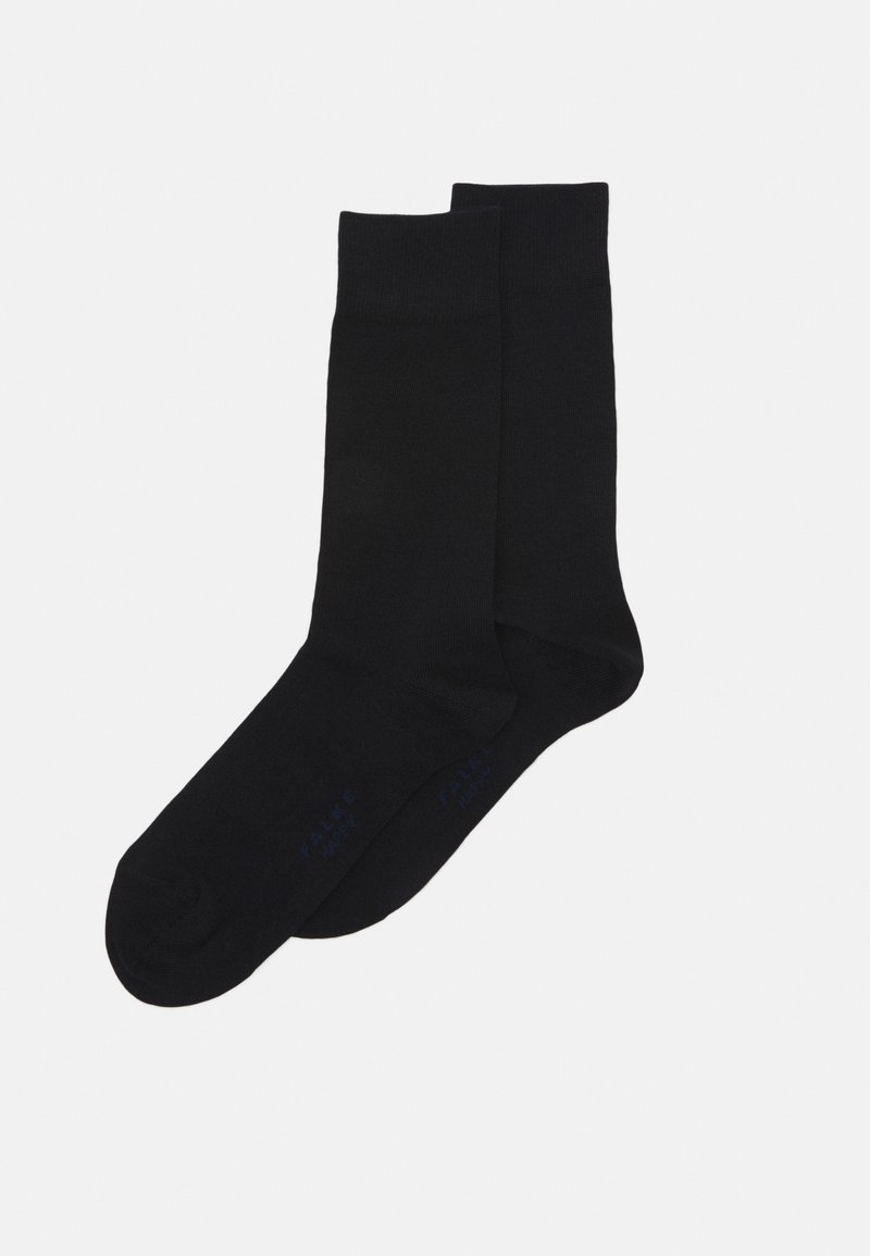 Calcetines de tripulación negros hechos de un material suave, con un puño acanalado y un sutil logo de la marca en azul cerca del dedo del pie.