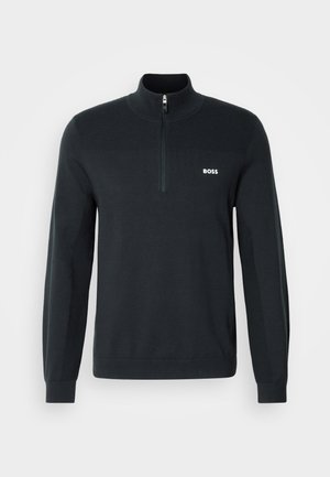 Felpa nera con zip al collo, realizzata in tessuto morbido, con una texture a coste nella parte superiore e un piccolo logo bianco sul petto.