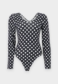 Μαύρο κορμάκι μακρυμάνικο με λευκά πουά και λαιμόκοψη σε σχήμα V, σε απλό λευκό φόντο.