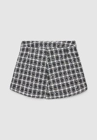 Shorts à motif noir et blanc avec un tissage texturé, dotés d'une large ceinture élastique et d'une coupe ajustée.