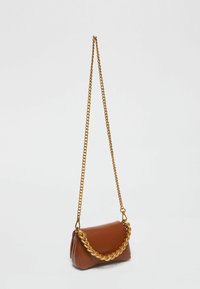 Brown leather shoulder bag with a textured surface, featuring a prominent gold chain strap and a compact, folded shape.
