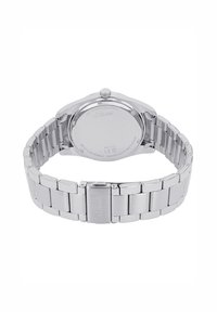 Edelstahlarmbanduhr mit polierter Oberfläche, runder Gehäuseform und Gliederarmband. Verfügt über einen einfachen Verschluss und ist wasserdicht.