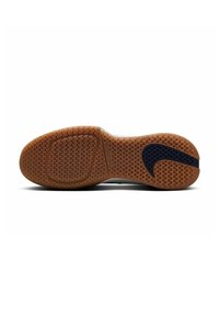 Rubber sneaker outsole with a textured surface, featuring a brown color and a dark blue swoosh design. Curved shape with grip patterns.
