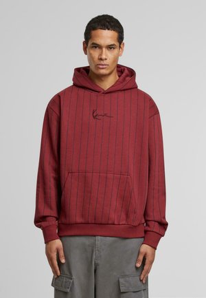 Maroon hoodie with vertical navy stripes, drawstring hood, front pouch pocket, and embroidered logo on chest. Cotton blend material.