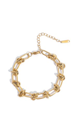 Gold-tone bracelet with elongated chain links, each featuring multiple knot details, and an adjustable clasp with a small tag.