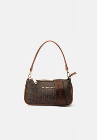 Brown patterned purse with gold hardware, featuring a flexible strap, zip closure, and embossed logo across the front.