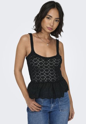 Top de crochet negro con peplum, escote cuadrado y tirantes anchos, que presenta patrones florales y un dobladillo con volantes. Combina con jeans de cintura alta.