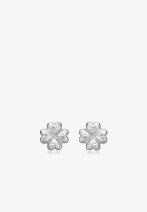 Boucles d'oreilles argentées en forme de fleur avec des pétales texturés et une finition polie, présentant des détails complexes dans un design symétrique.