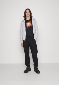 Nike Sportswear FRANCHISE TEE - T-shirt estampada - black