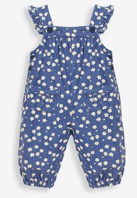 Blaue Corduroy-Latzhose mit weißem Gänseblümchenmuster, Rüschenträgern, Knopfdetails und Taschen vorne. Geraffte Bündchen am Knöchel.