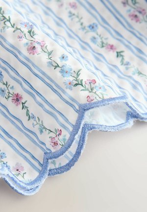 Lillemustriline kangas siniste ja valgete triipudega. Omab lainelisi servasid ja hele sinist õmblust. Pehme tekstuur ja kerge disain.