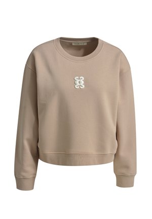 Light beige sweatshirt in a textured fabric with a crew neckline, featuring a white embroidered logo at the center and ribbed cuffs.