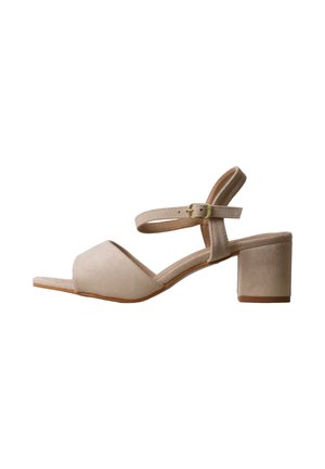 Beige suede women's sandal with open toe, block heel, and adjustable ankle strap with gold buckle.