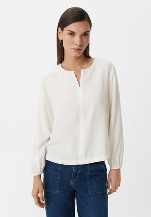 White, long-sleeve blouse with a round neckline and a short front slit. The fabric is smooth and slightly sheer, with gathered sleeves at the cuffs.