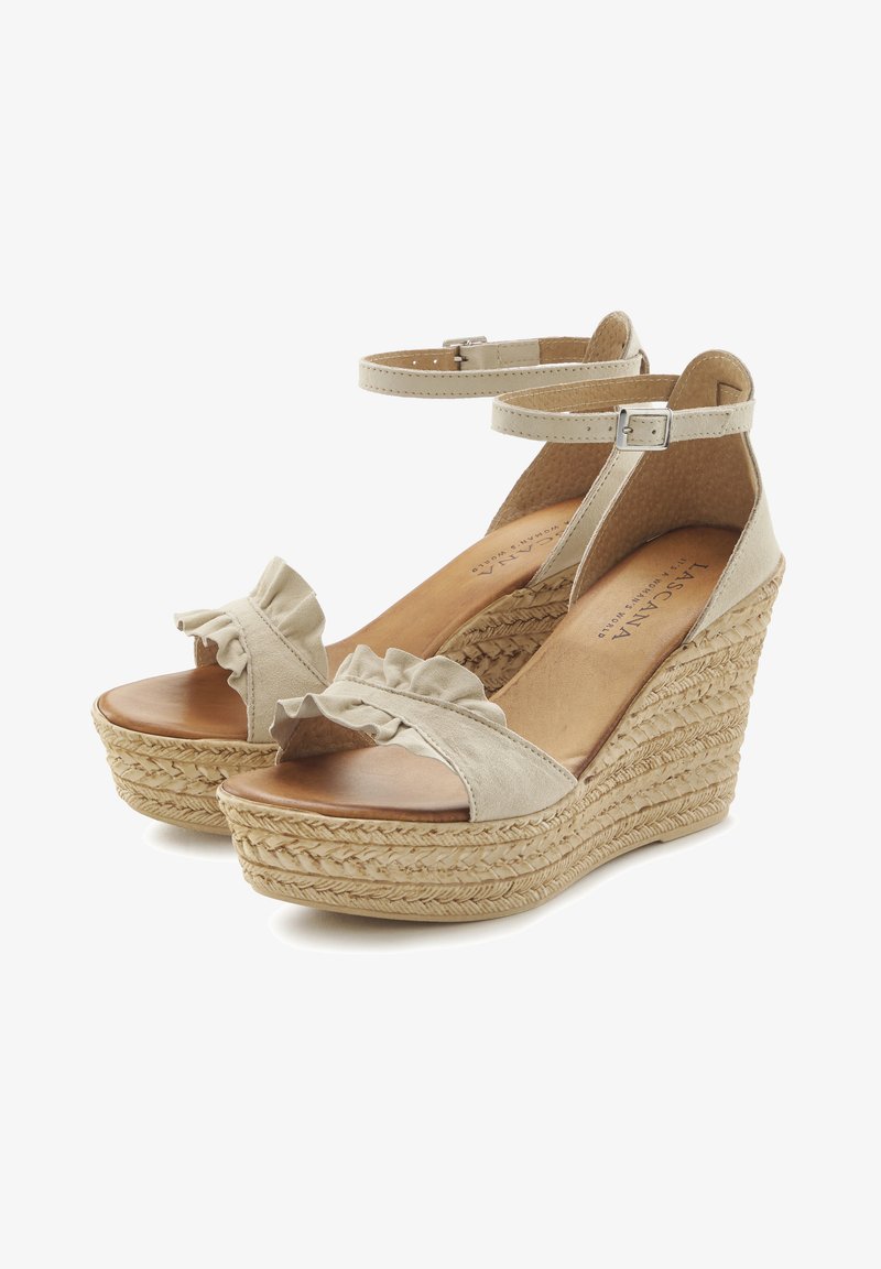 Beige wedge sandals with a fabric ruffle detail on the toe, ankle strap, and a woven jute platform sole. Smooth leather insole.
