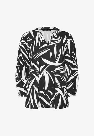 Schwarz-weißes Oberteil mit V-Ausschnitt und langen, gepufften Ärmeln, das ein auffälliges Blattmuster auf glattem Stoff zeigt.