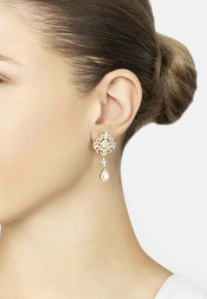 Gold-tone earrings with intricate filigree design, featuring a large crystal accent and a pear-shaped drop pendant.