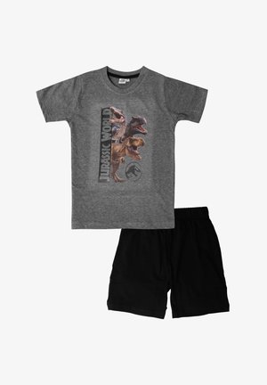 T-shirt grigio in cotone con grafiche di dinosauri di Jurassic World, abbinato a pantaloni corti neri con cintura elastica.