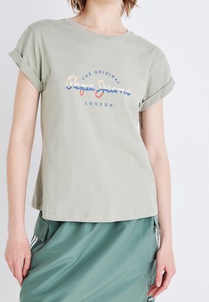 Light green cotton t-shirt with rolled sleeves; features "Pepe Jeans London" logo in blue and orange across the chest.