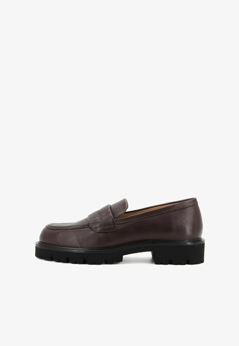 Brown leather loafers with a rounded toe, featuring a decorative stitched panel and a textured black rubber sole.