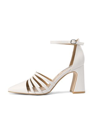 Sandali con tacco bianco e punta affusolata, con tagli verticali, cinturino alla caviglia e tacco chunky. Materiale in pelle liscia con soletta color crema.