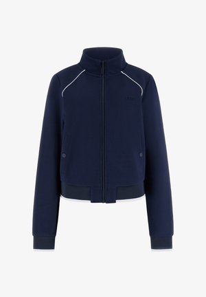 Granatowa kurtka zapinana na zamek z wysokim kołnierzem, teksturowana tkanina, dwie przednie kieszenie na zatrzaski, białe lamówki na ramionach oraz ściągacze na mankietach i dole.