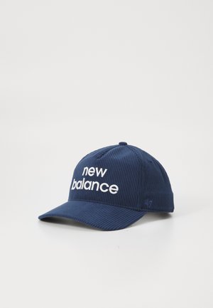 Navy blue corduroy baseball cap with white embroidered "new balance" logo on front and small '47 branding on side.
