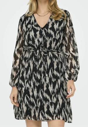 Zwarte en beige gestreepte jurk van doorschijnende stof, met een V-hals, lange pofmouwen en een tailleband voor een getailleerde pasvorm.