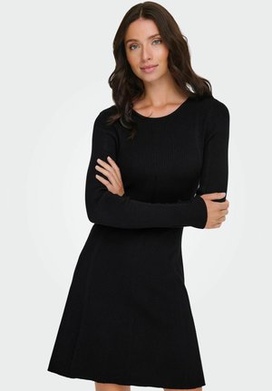 Schwarzes, geripptes Strickkleid mit langen Ärmeln, Rundhalsausschnitt und ausgestelltem Rock. Verfügt über einen strukturierten Stoff und eine taillierte Silhouette.