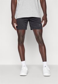 Champion TRAIN SHORTS BERMUDA SMALL LOGO - Sporta šorti - black
