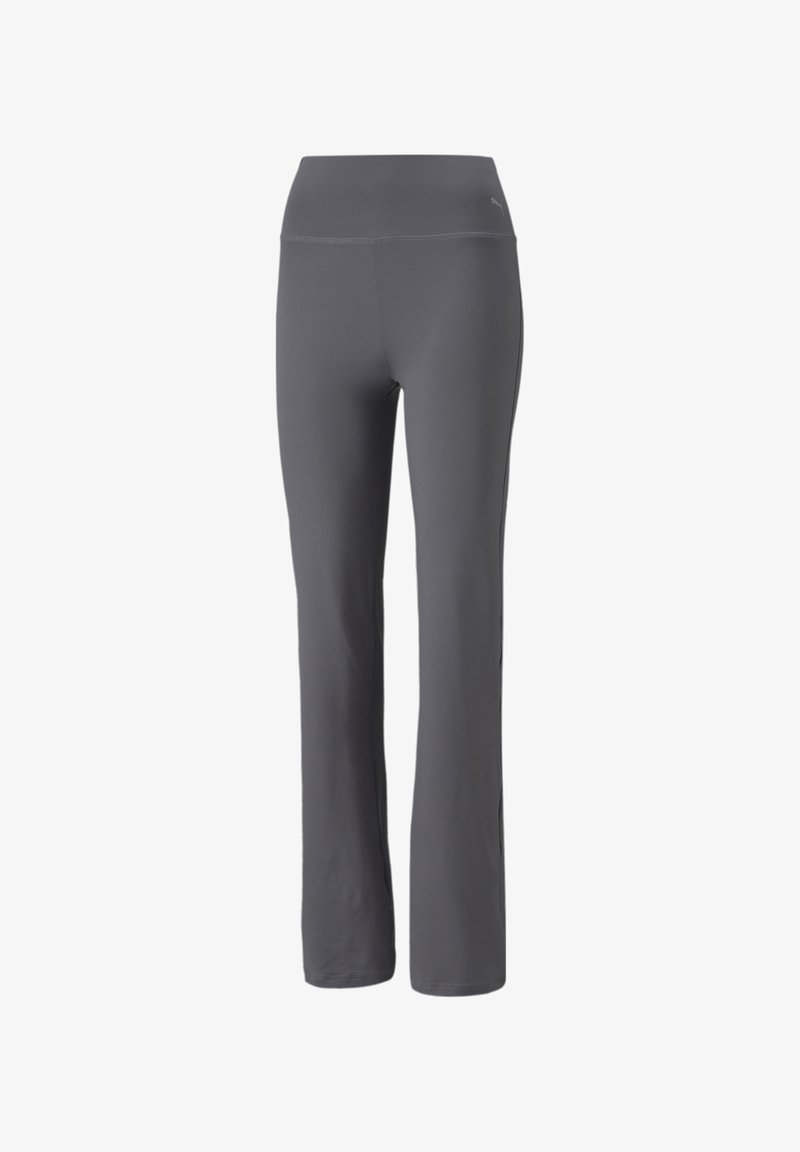 Pantalon de sport ajusté gris foncé avec une taille haute et un léger évasement en bas, avec un petit logo Puma près de la hanche.