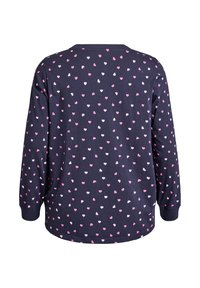 Mörkblå långärmad topp med rund hals, med ett mönster av små rosa och vita hjärtan jämnt fördelade över ryggen. Mjukt tyg.