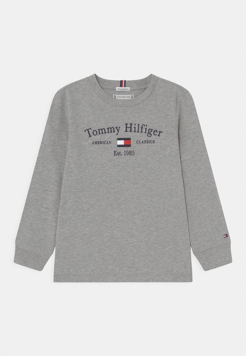 Grey long-sleeve sweatshirt with round neckline, featuring "Tommy Hilfiger American Classics" print in navy, with logo accents on the sleeves.