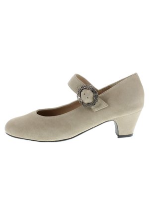 Beige suede Mary Jane shoe with a rounded toe, a strap with a decorative silver buckle, and a short, chunky heel.