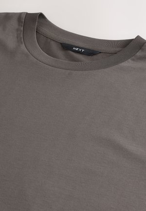 Gray cotton t-shirt with a crew neckline, featuring a smooth texture and a brand label stitched inside the collar.