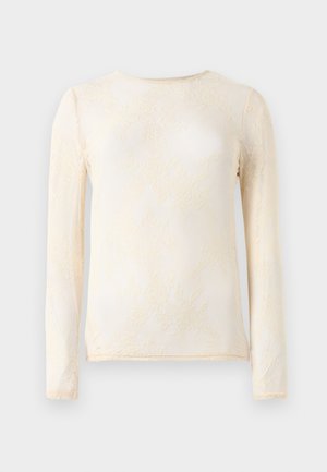 Haut à manches longues en crème clair avec une texture en dentelle délicate et un motif floral. Encolure ronde, coupe ajustée et finition en tissu doux.