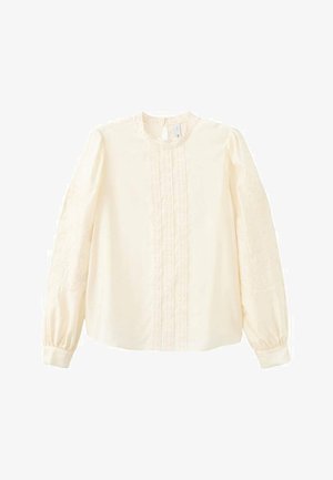 Kremowa bluzka z długim rękawem, ozdobiona koronką na przodzie i rękawach, z okrągłym dekoltem i mankietami na nadgarstkach.