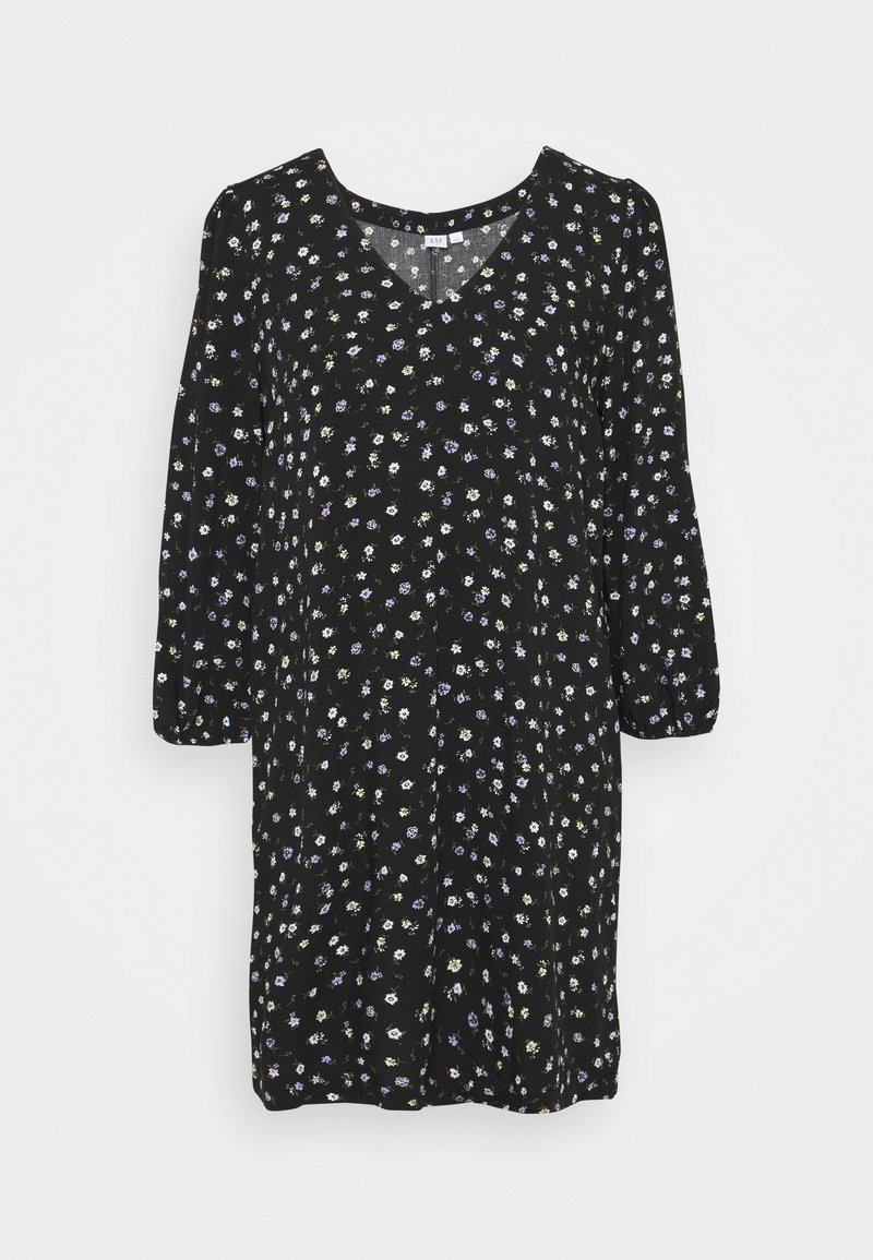 Robe noire à fleurs avec un décolleté en V, des manches trois-quarts, ornée de petites fleurs blanches, violettes et vertes réparties sur le tissu.