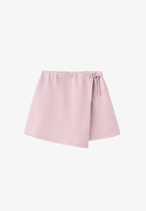 Jupe portefeuille rose clair avec taille élastique et fermeture nouée sur le côté, confectionnée en tissu doux.