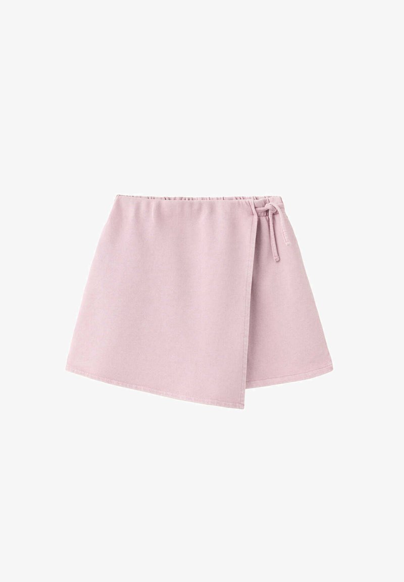 Jupe portefeuille rose clair avec taille élastique et fermeture nouée sur le côté, confectionnée en tissu doux.
