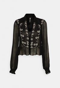 Blusa nera trasparente con maniche lunghe, decorata con motivi floreali e bottoni sul davanti, caratterizzata da un orlo arricciato e polsini arricciati.