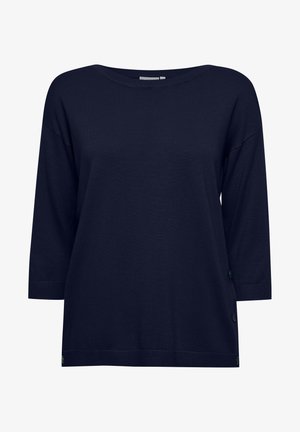 Marine modra pulover majica, izdelana iz mehke pletene tkanine, z rokavi do tri četrtine in dekorativnimi gumbi ob strani. Gladka tekstura.