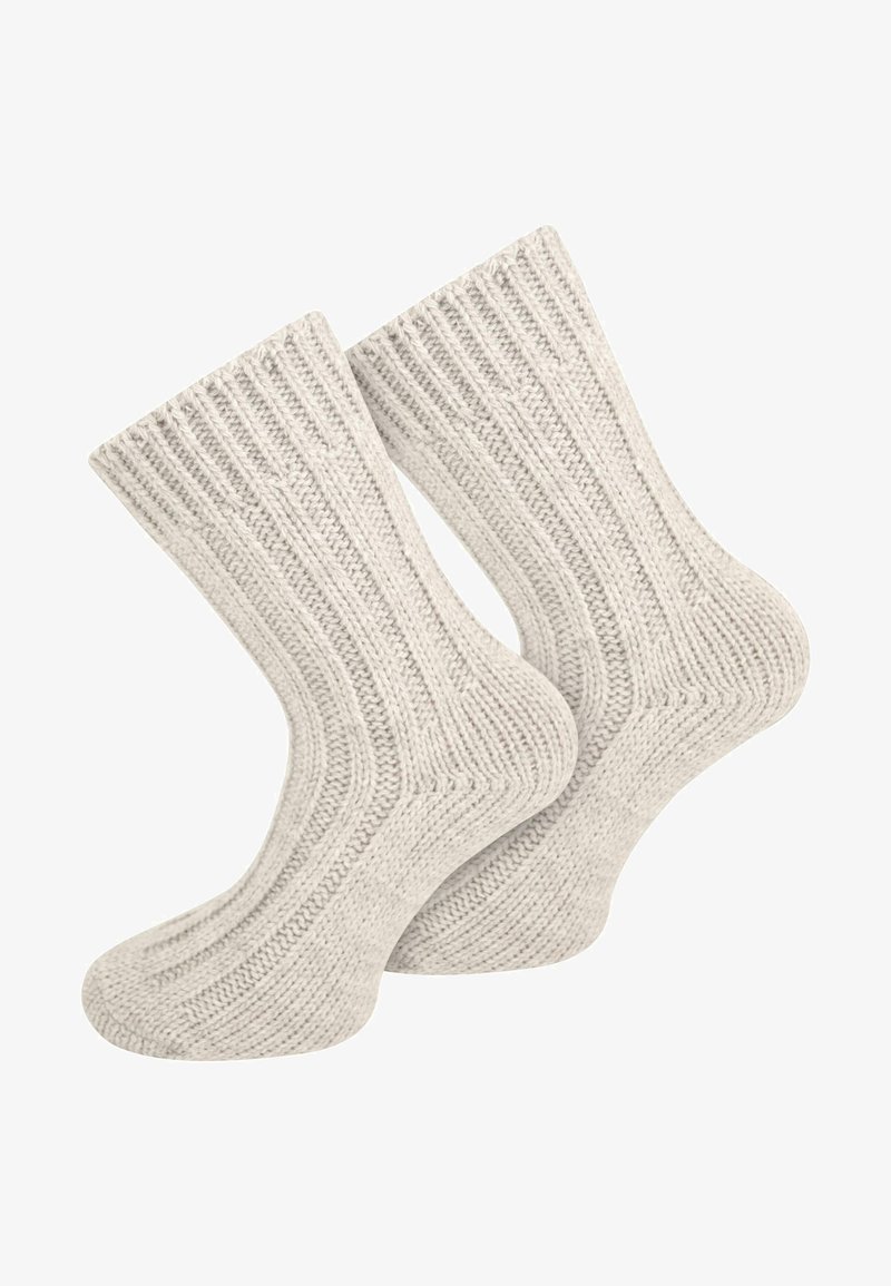 Graue gestrickte Socken verfügen über ein geripptes Design, eine weiche Textur und eine Crew-Länge. Sie haben eine verstärkte Ferse und Spitze für zusätzliche Haltbarkeit.