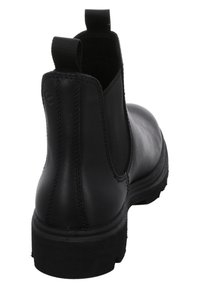 Bottine Chelsea en cuir noir avec panneaux élastiques sur les côtés, bout arrondi et semelle en caoutchouc texturé, dotée de détails de couture et de languettes.