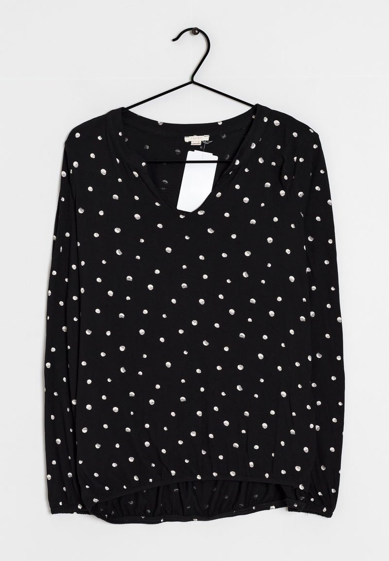 Schwarzes Langarmshirt mit V-Ausschnitt, versehen mit verstreuten weißen Punkten. Weicher Stoff mit einem gerafften Saum am unteren Ende. Einzelhandelsetikett angebracht.