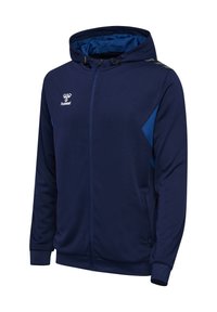 Veste à capuche zippée de couleur marine avec un accent bleu sur le côté. Fabriquée dans un tissu texturé, elle dispose d'une capuche avec cordon de serrage et de poches latérales.