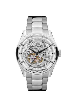 Hopeinen metallirannekello, jossa näkyvät mekaaniset rattaat ja mustat tunti-, minuutti- ja sekuntiosoittimet näyttämässä aikaa 10:09:38.