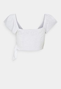 Top bianco corto con maniche corte a sbuffo. Realizzato in tessuto testurizzato, presenta un collo quadrato e un dettaglio con fiocco laterale.