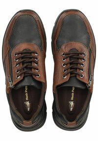 Scarpe in pelle marrone e nera con chiusura a lacci e zip. Punta arrotondata, dettagli testurizzati e suole interne imbottite. Marchio Hush Puppies all'interno.